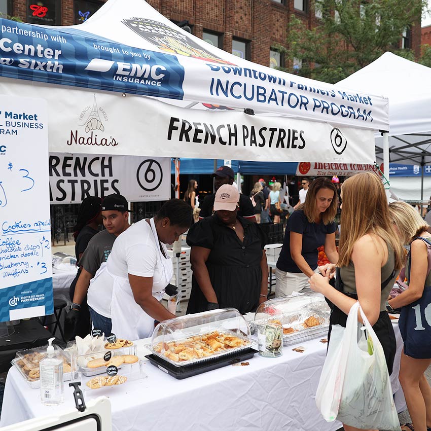 booth that says french pastries at a farmers market